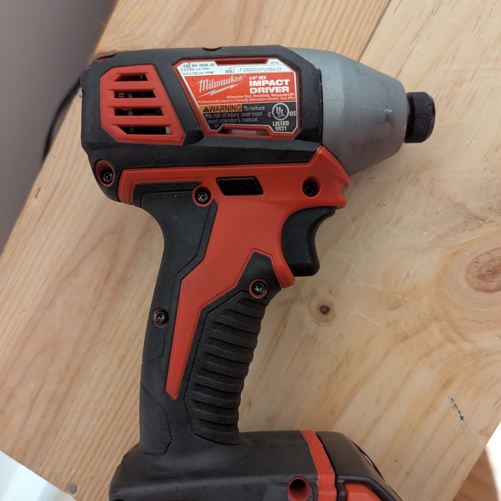 Milwaukee Red and Black Impact Driver